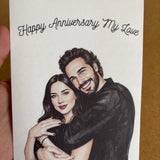 Hand holding a custom watercolor anniversary greeting card created from a personal photo.